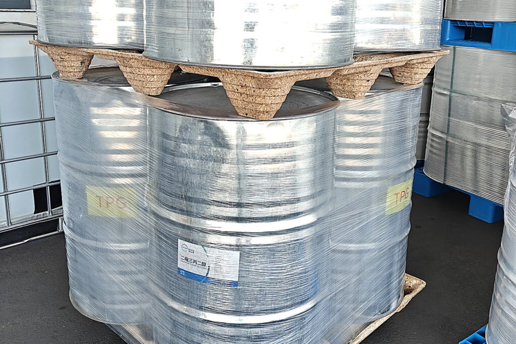 Presswood pallets carrying three stacked layers of chemical steel drums