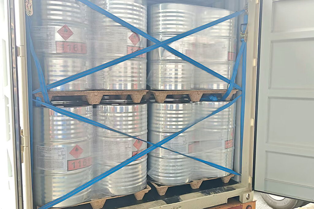 Compressed wood pallets with steel drums loaded in a truck